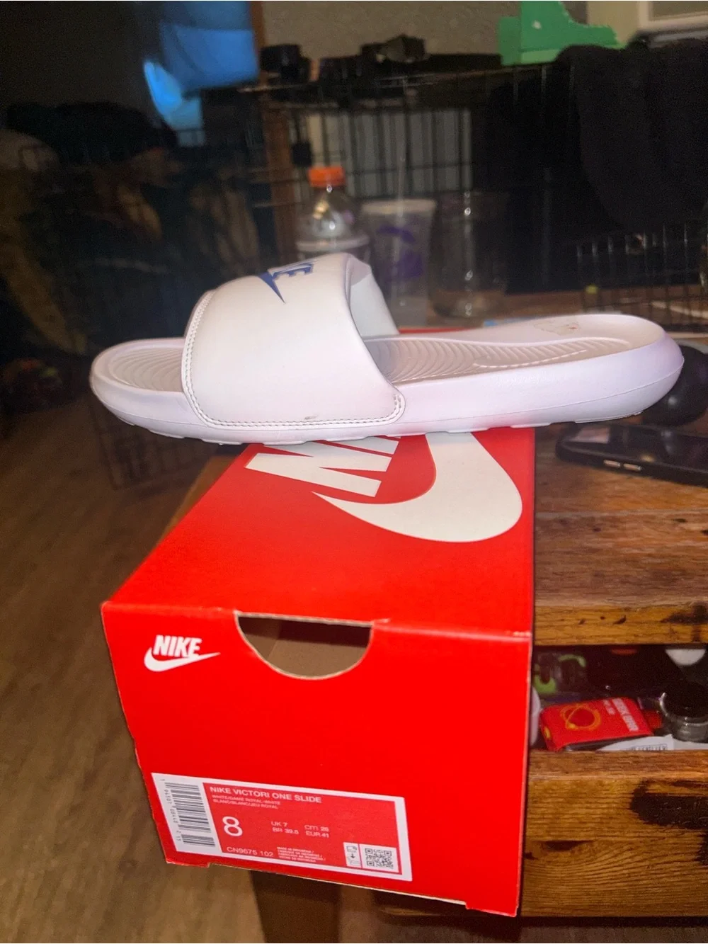 Nike White Slide Sandals with Blue Swoosh